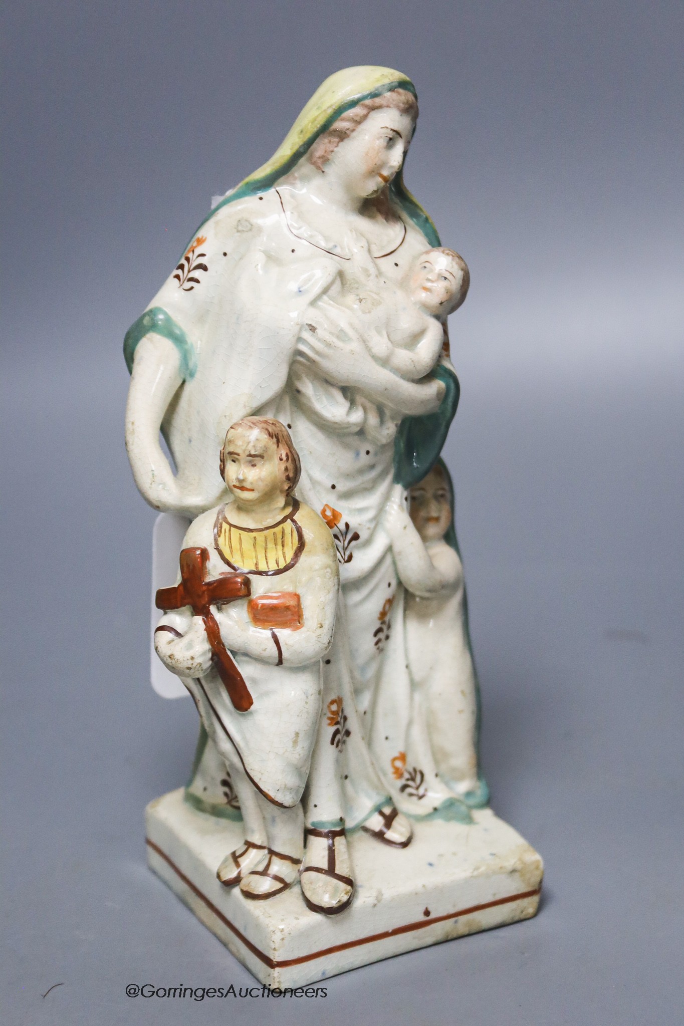 A Staffordshire pearlware group of a mother and children, c.1800, height 19cm